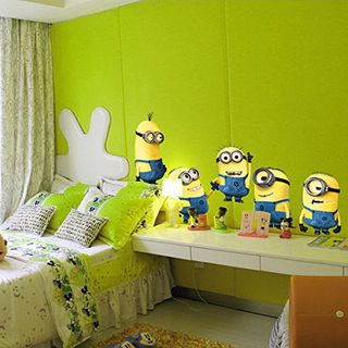 childrens bedroom with green wall with minions stickers