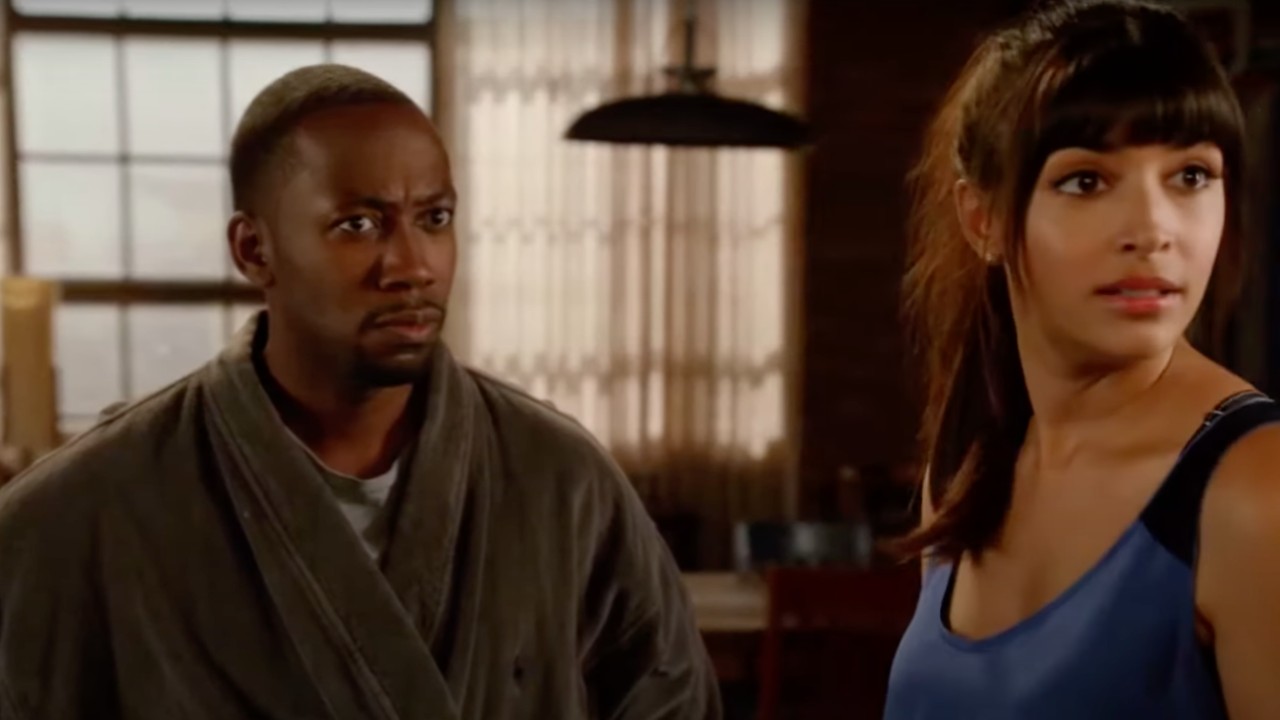 Lamorne Morris and Hannah Simone in New Girl looking at Max Greenfield with concern and disbelief in their eyes.