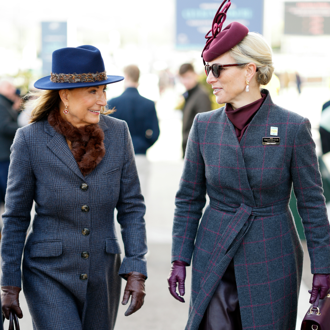 Carole Middleton and Zara Tindall wearing gray coats walking next to each other