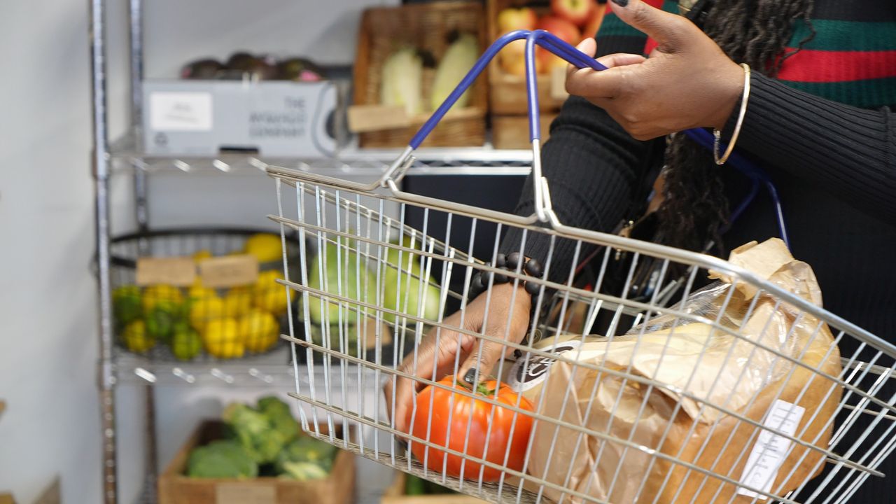 Shopping basket with groceries in supermarket.