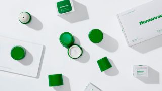 Birdseye view of green packaged skincare products