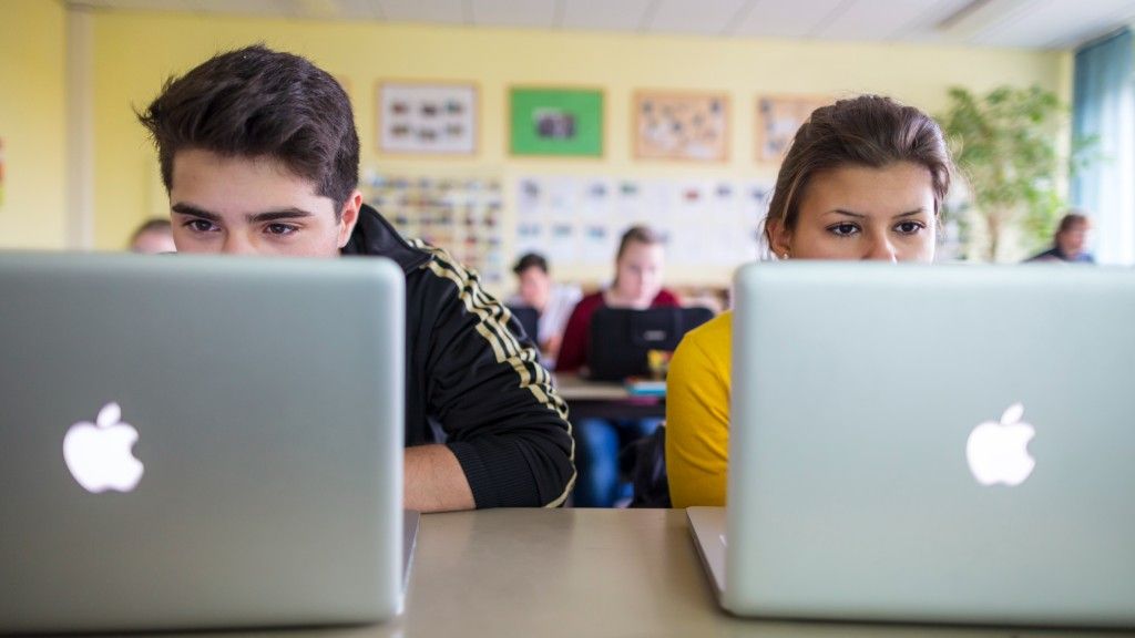 Students working with MacBook 