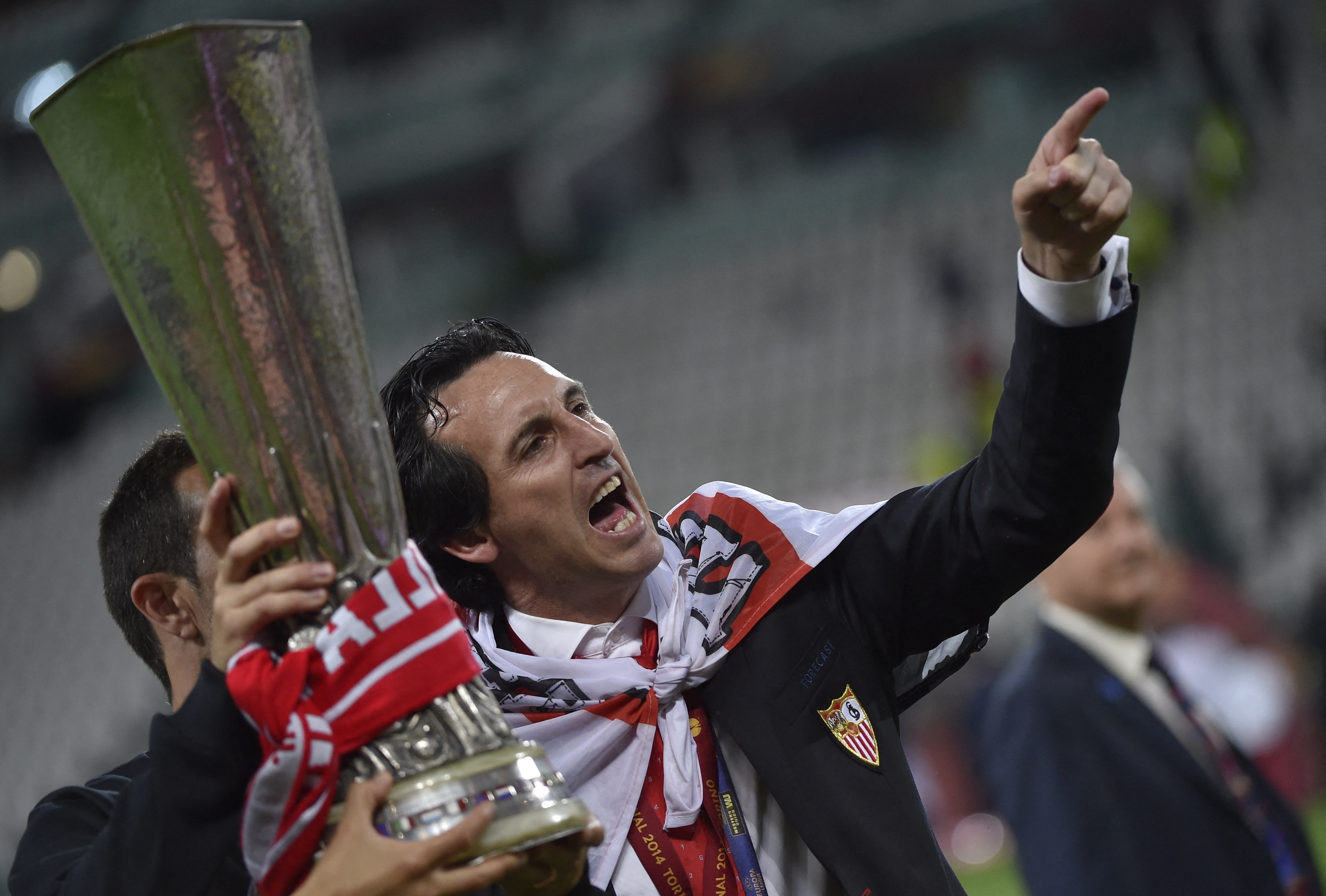 Unai Emery celebrates with the Europa League trophy after Sevilla's win over Benfica in the final in May 2014.