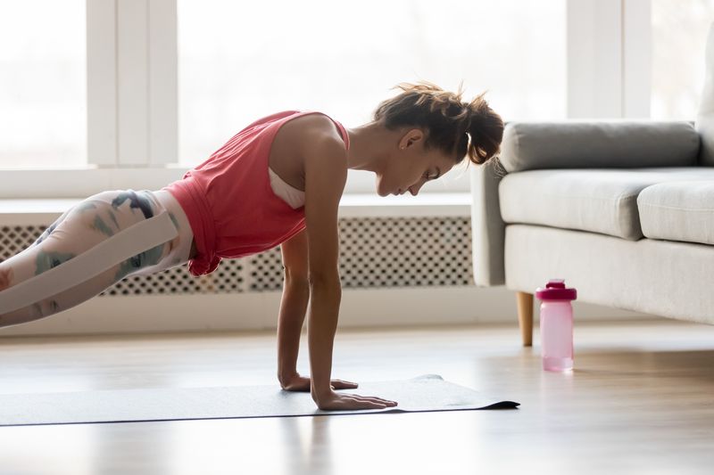 A woman doing press-ups at home