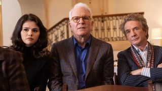 Selena Gomez, Steve Martin, and Martin Short stand in a line looking concerned