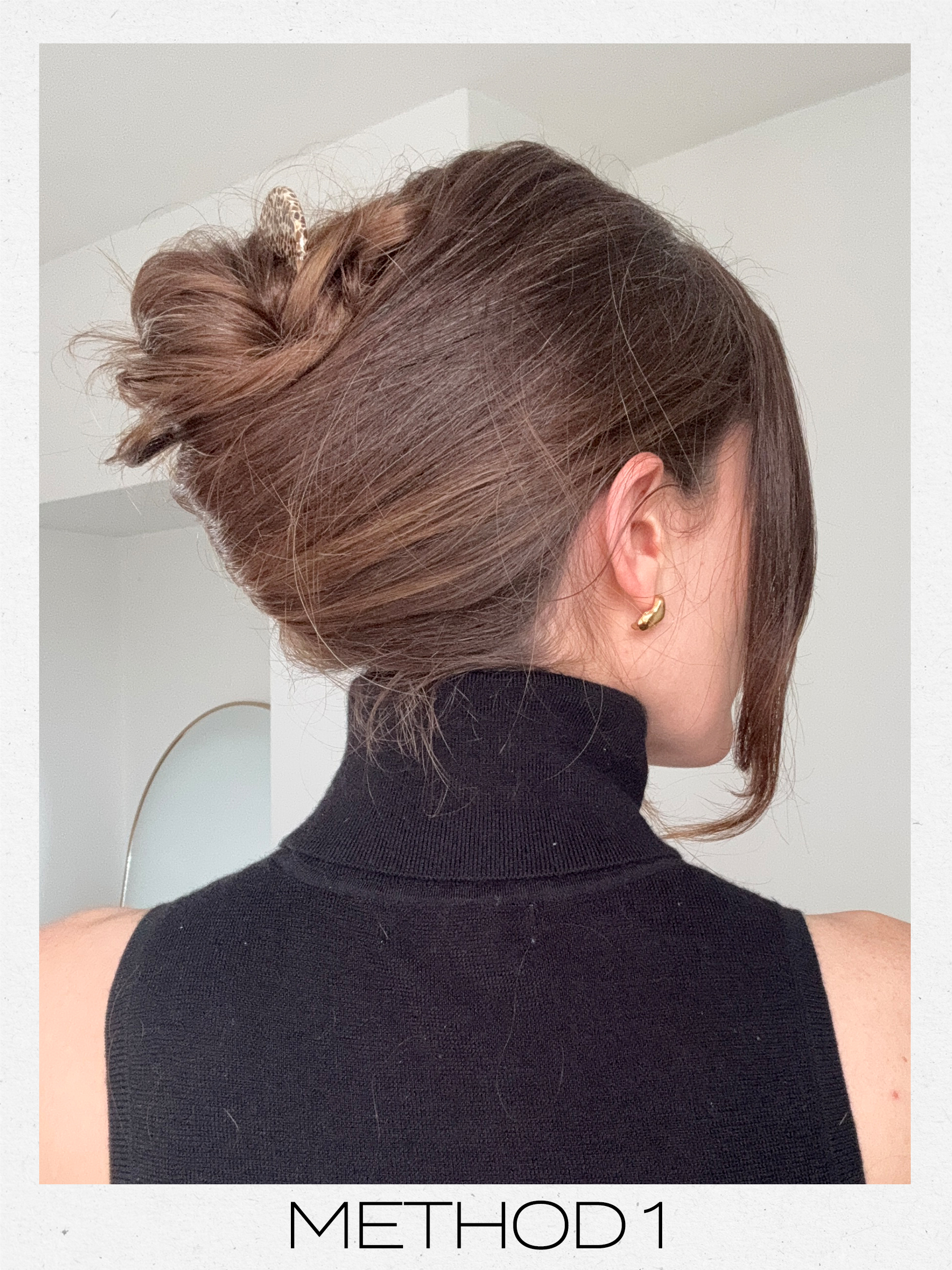 Eleanor's hair styled into a French twist updo using a French pin, using her fingers to create the twist