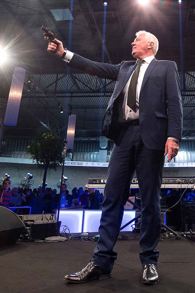 Patrick Lefevere shoots the starter's pistol at the Etixx-QuickStep team presentation.