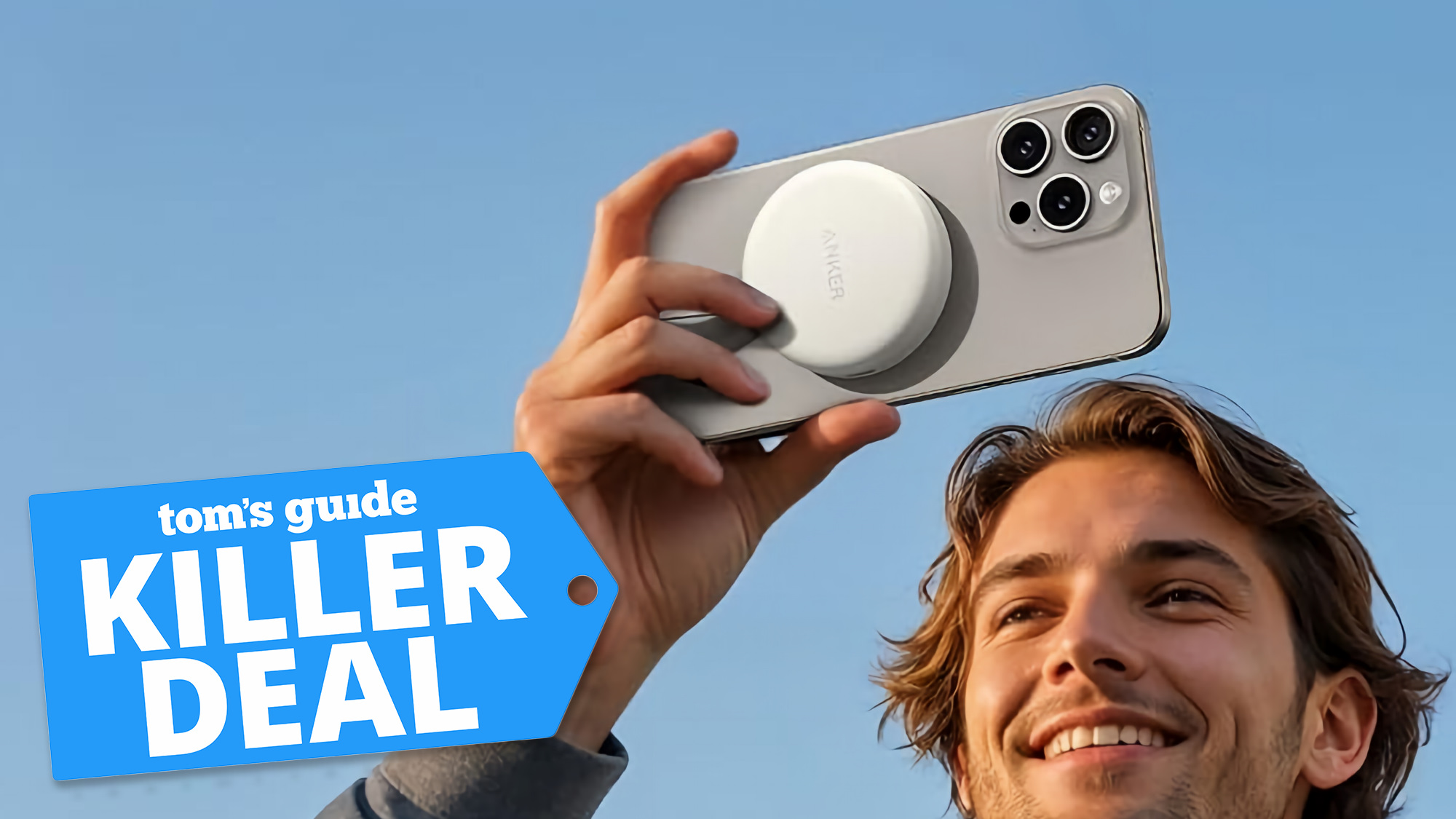 Man holding iPhone with Anker MagGo USB-C Adapter attached to the back.