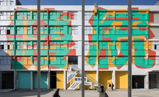 Pingheng, Understanding Chinese Reality is a colourful mural by collective Boa Mistura on the facade of the former factory hosting the UABB exhibition