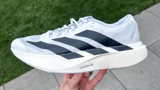 Adidas Adizero Evo SL held in a person's hand