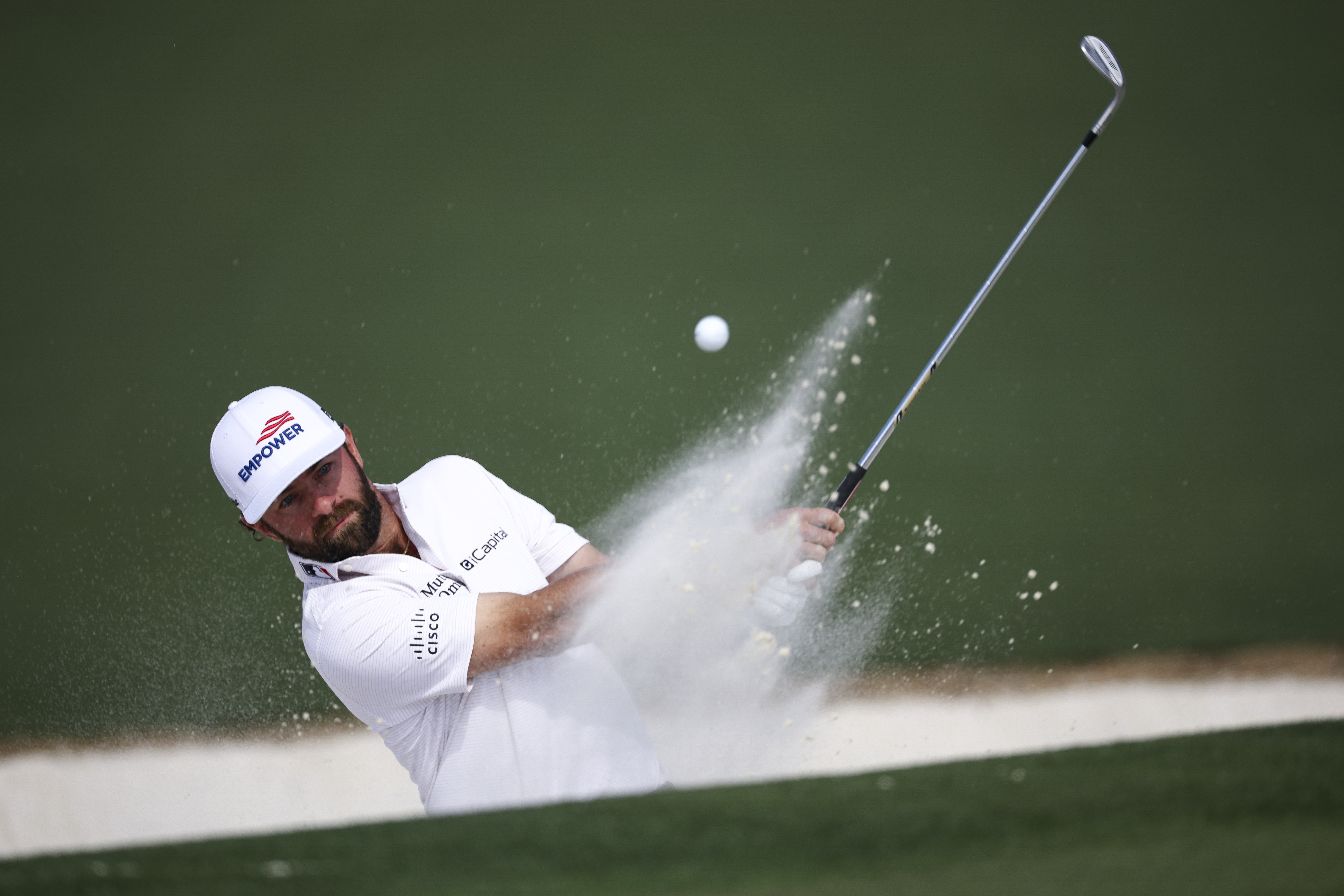 Cameron Young plays a shot from a bunker on the second hole during the first round of the 2026 Masters Tournament at Augusta National Golf Club