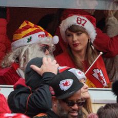 KANSAS CITY, MO - DECEMBER 25: Artis Taylor Swift in the stands with an 87 Santa hat on during the game between the Kansas City Chiefs and the Las Vegas Raiders on December 25th, 2023 at Arrowhead Stadium in Kansas City, Missouri. (Photo by William Purnell/Icon Sportswire via Getty Images)