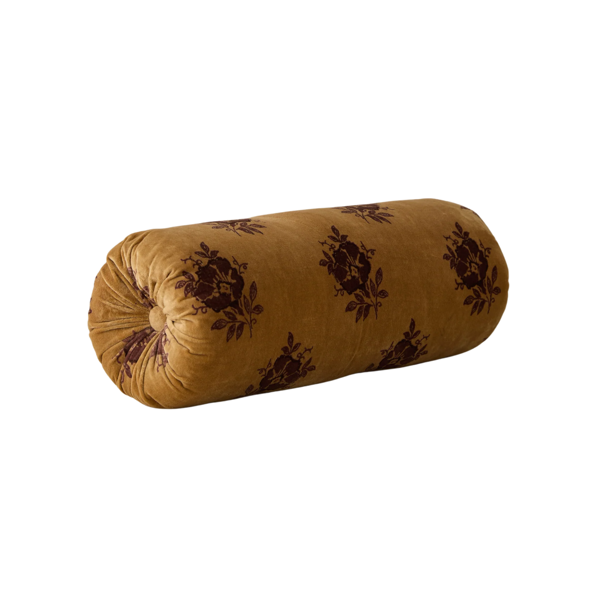 a mustard yellow pillow with deep red floral details