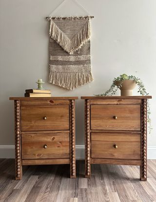 Image of two wooden nightstands beside each other in a room with gray walls and a gray hardwood floor