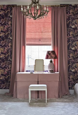 Chintzy dark floral wallpaper with pastel pink curtains