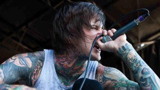 Suicide Silence’s Mitch Lucker singing onstage in 2011