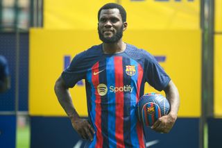 Barcelona's new Ivorian midfielder Franck Kessie poses with a ball during his presentation ceremony at the Joan Gamper training ground in Sant Joan Despi, near Barcelona on July 6, 2022.