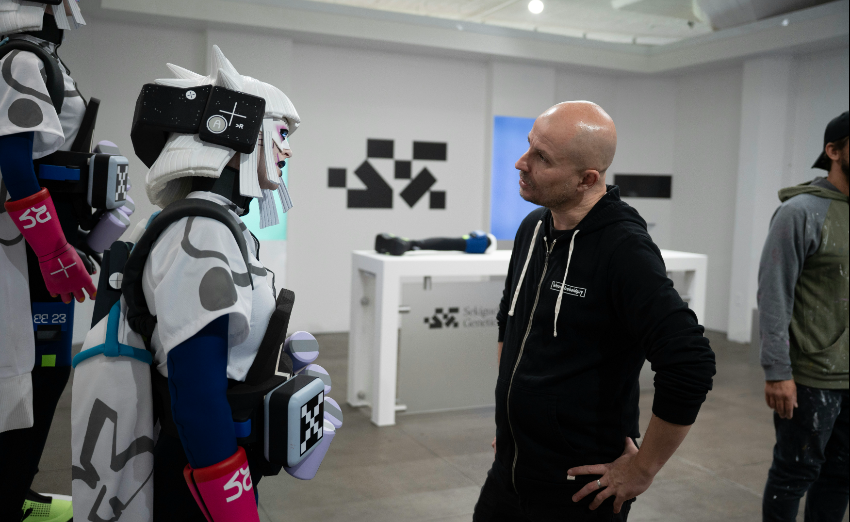 a sci-fi cyborg character with a director on set