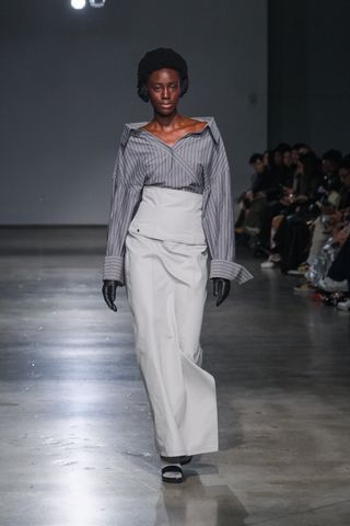 A distorted striped button-down shirt and 100-percent cotton maxi skirt from Jane Wade Fall 2024.