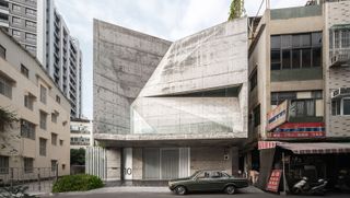 Star house with its angular concrete facade as seen from the street