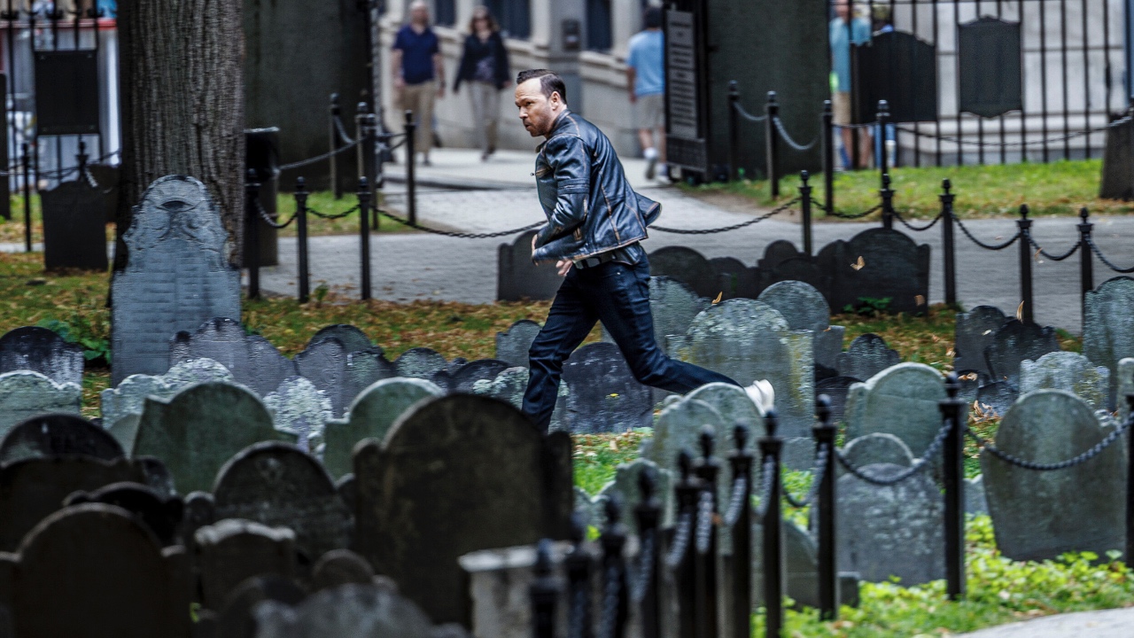Danny Reagan chasing in cemetery in Boston Blue 101
