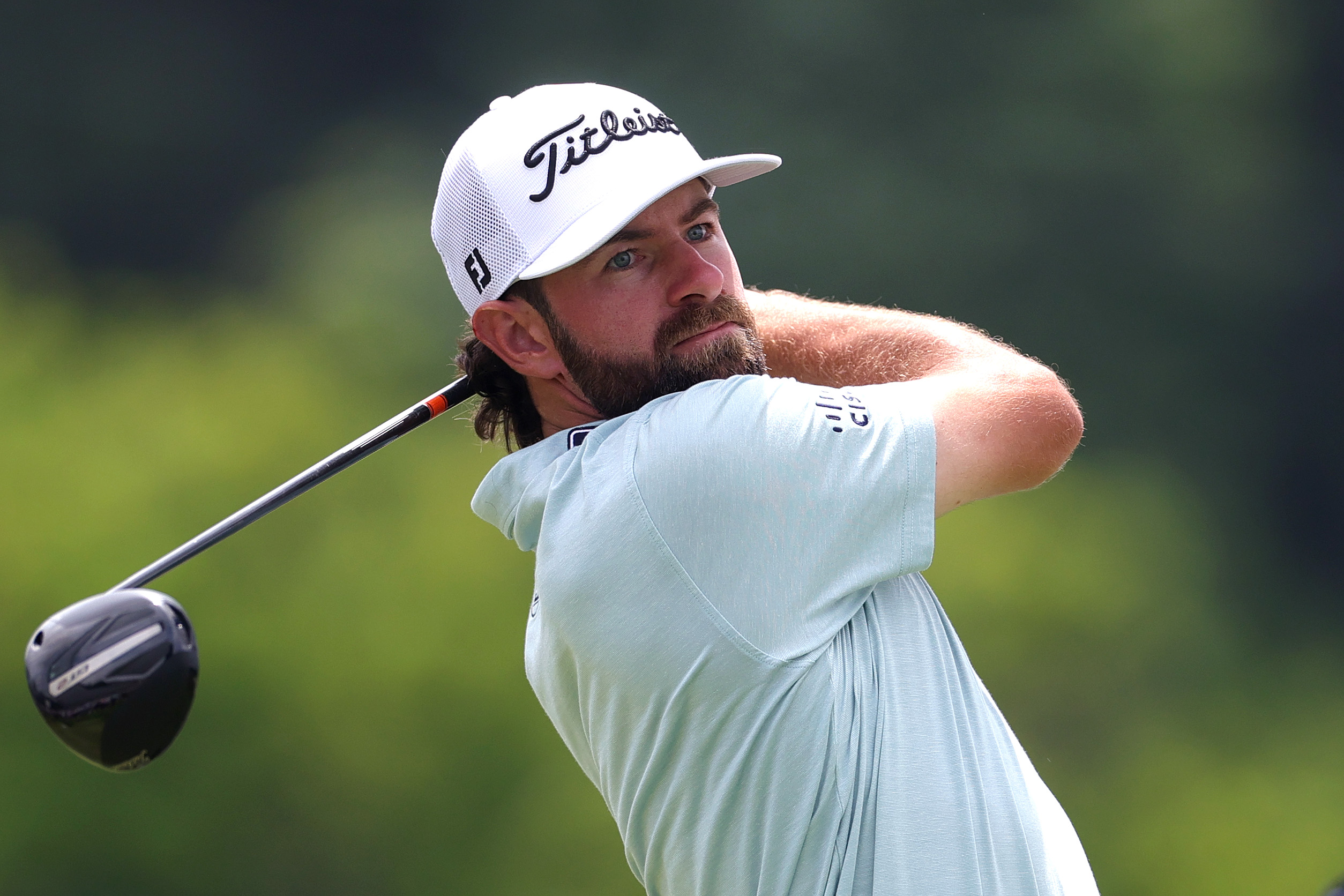 Cameron Young hits a driver