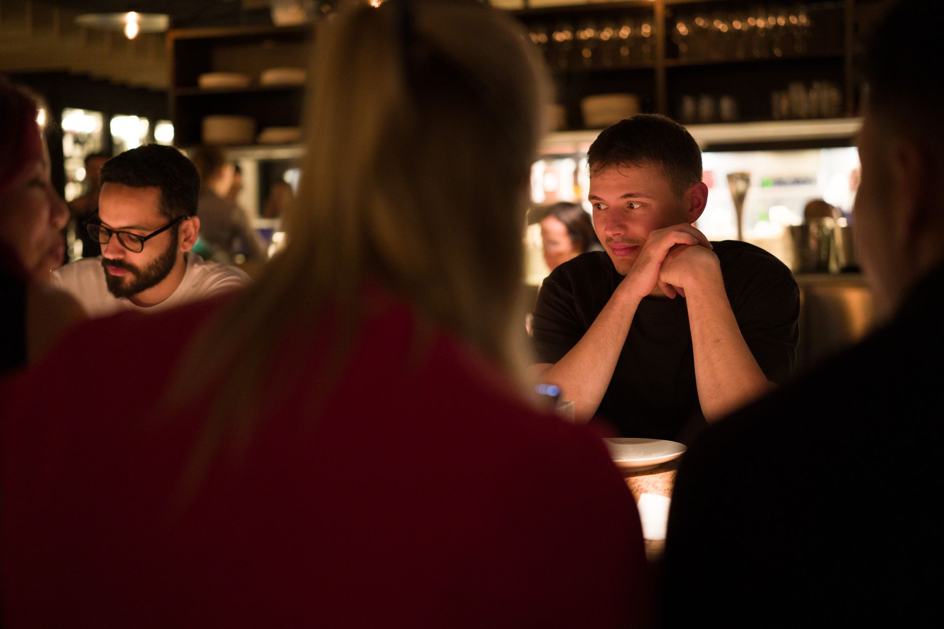  man sat at a table in a restaurant
