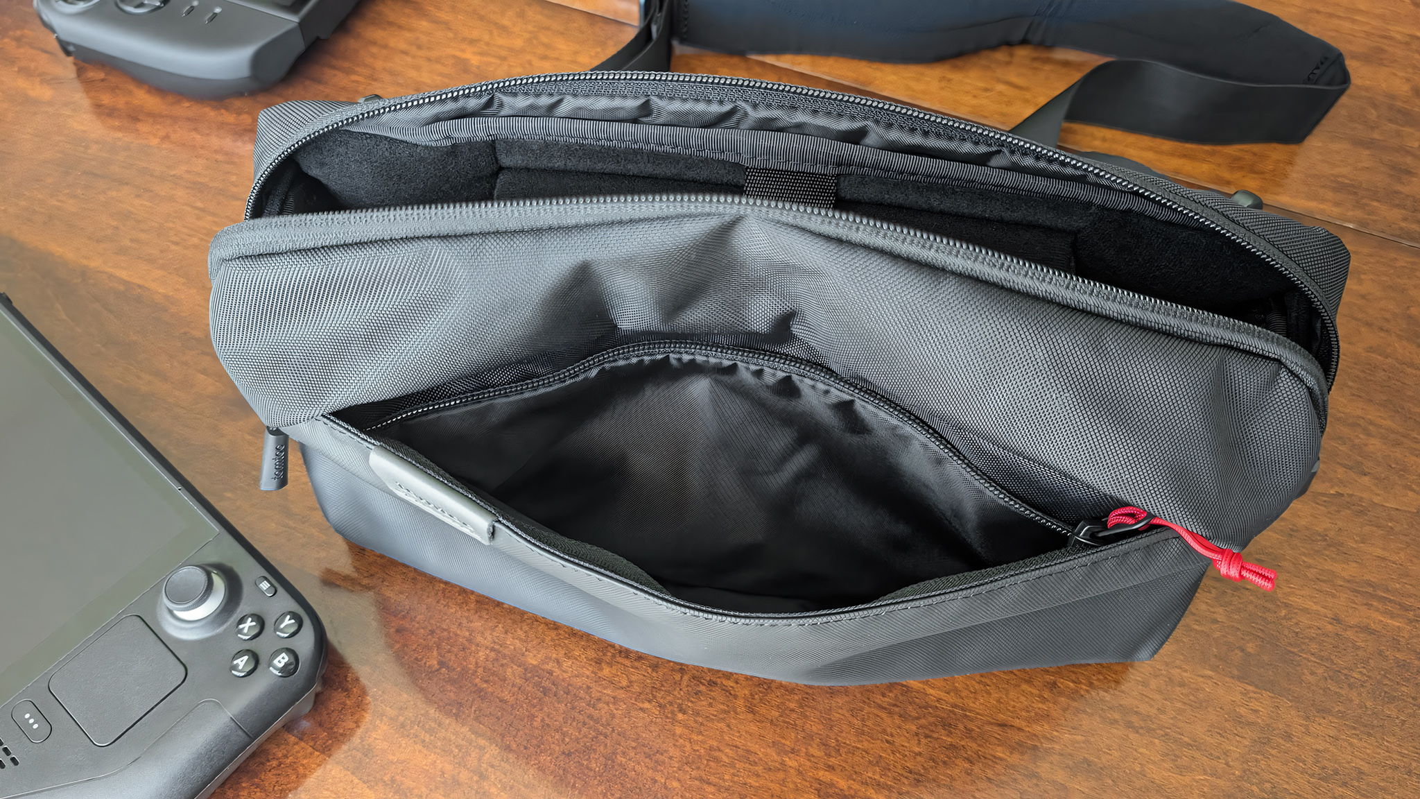 The front pocket unzipped and open on the Tomtoc Arccos G-47 Travel Bag