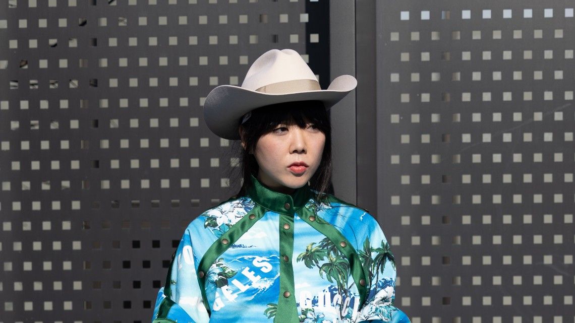 Susie Lau is seen ahead of the Gucci fashion show wearing a cowboy hat during the Milan Fashion Week Fall/Winter 2022/2023 on February 25, 2022 in Milan, Italy.