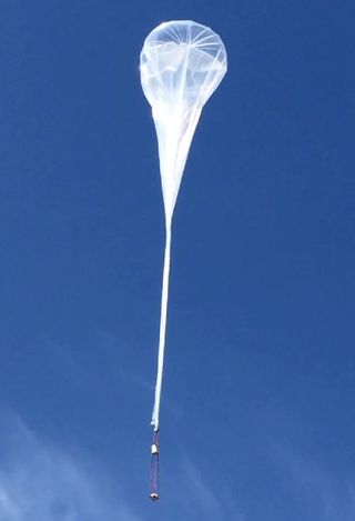 A high-altitude balloon lifted the prototype space re-entry capsule high into the air for a flight test.