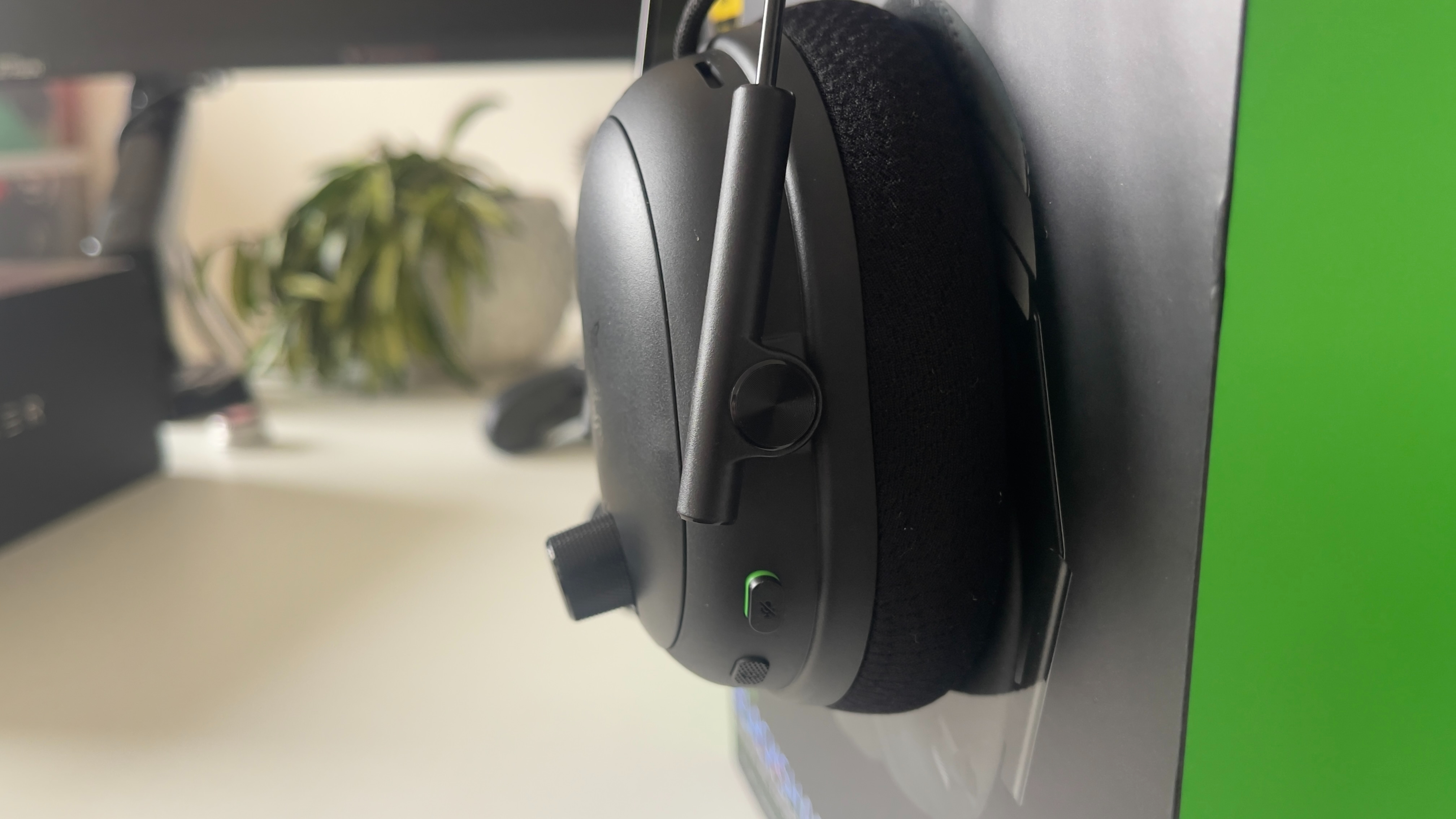 The Razer BlackShark V3 Pro headset on its box on a desk