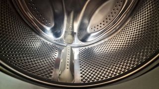 Inside a washing machine being cleaned