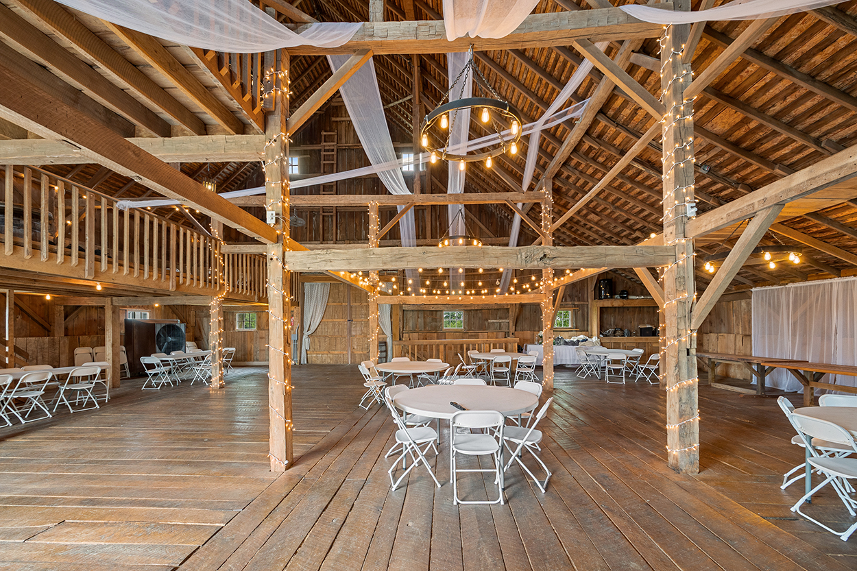 Barn interior with lights and tables