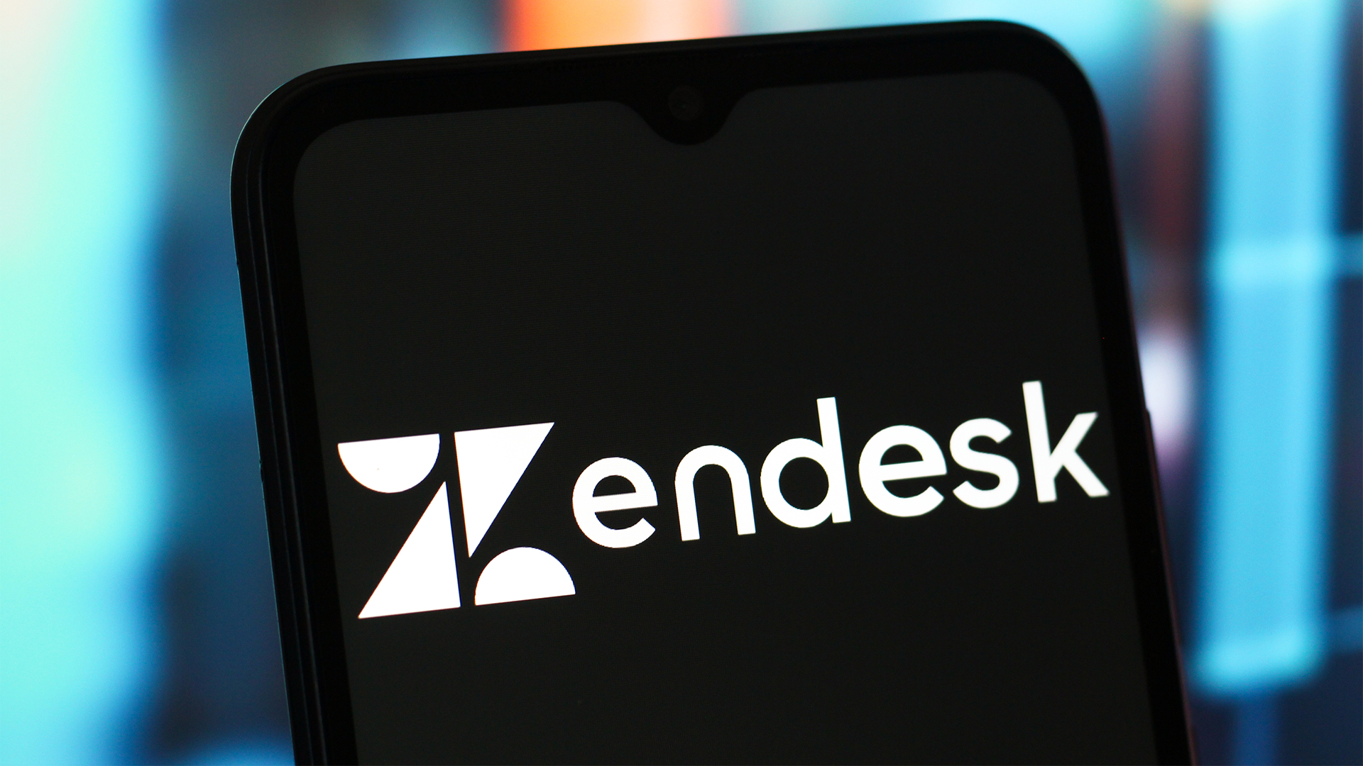 Zendesk logo and branding pictured on a smartphone screen. 