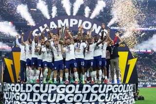 USMNT players celebrate after winning the CONCACAF Gold Cup in August 2021.