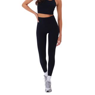 Best yoga clothes: black adanola leggings on the model