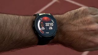 A track run summary on the Garmin Fenix 8, with the built-in LED flashlight on and visible and the intensity menu shown on the side.