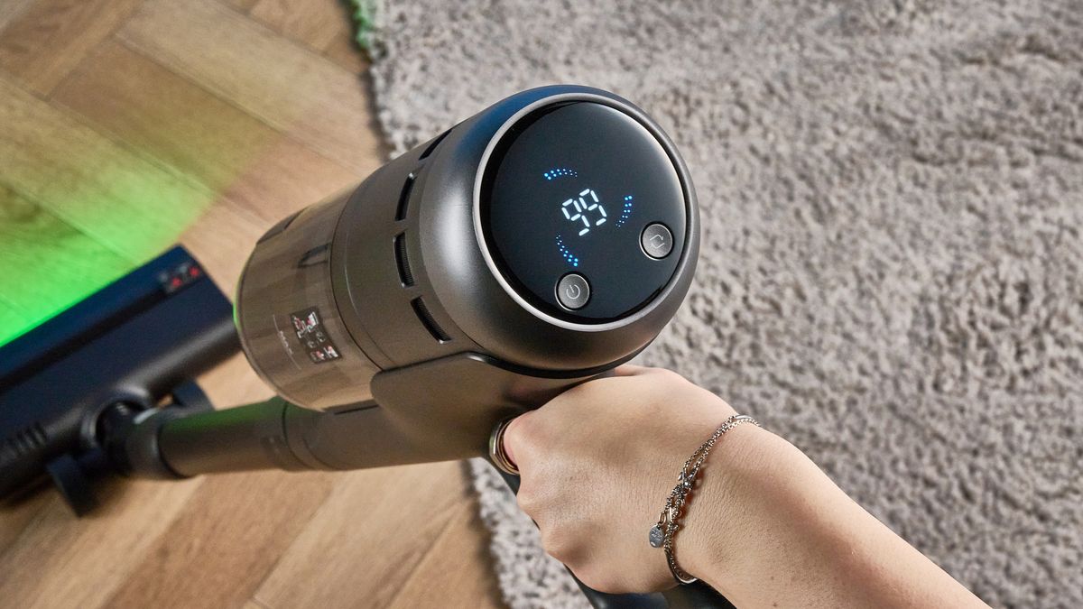 Roborock H60 Hub Ultra photograped in front f a blue background