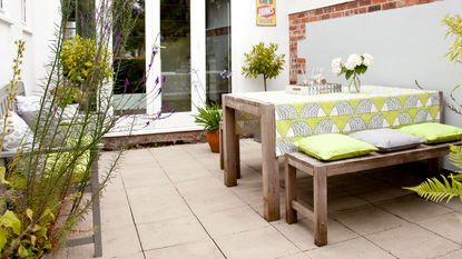 patio area with table and bench