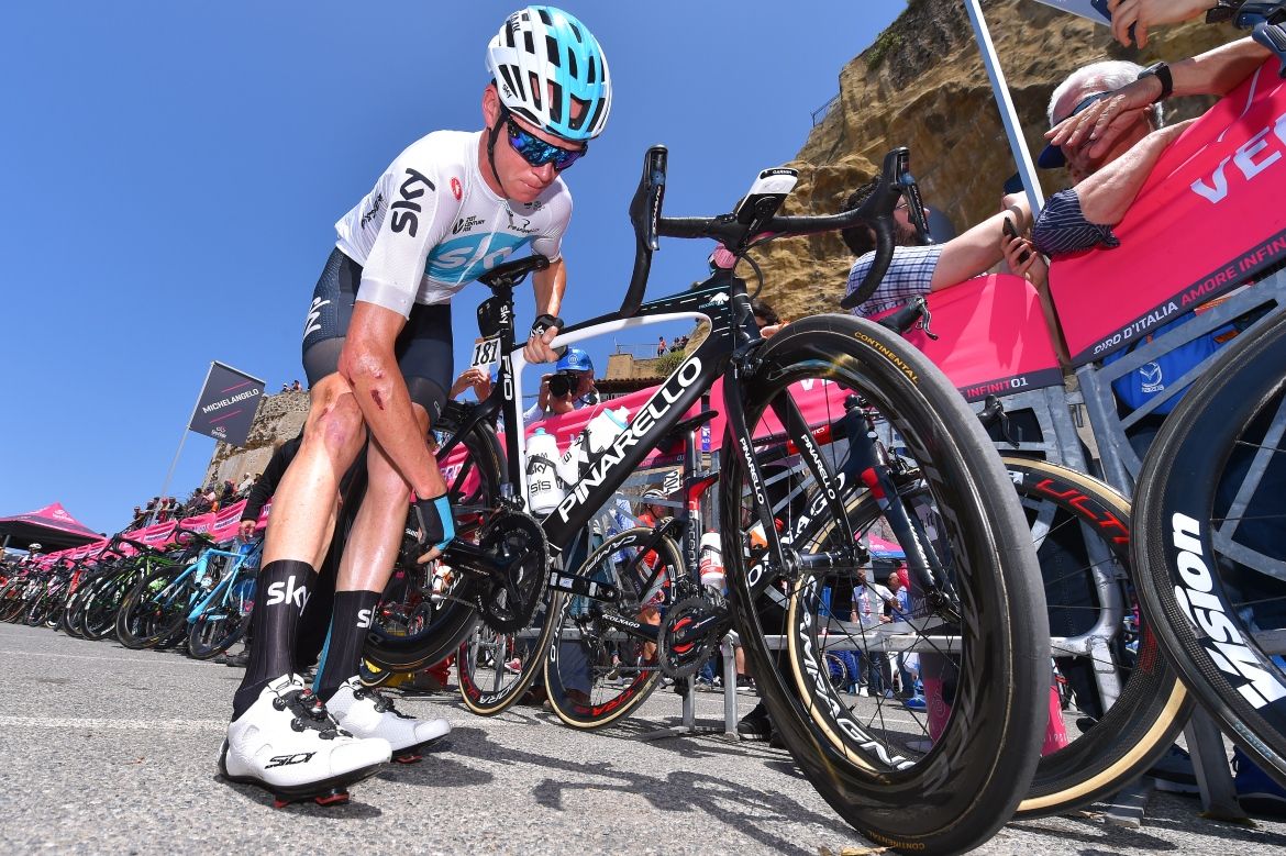 Chris Froome (Team Sky) checks his bike before stage 7