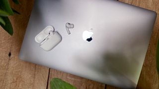 AirPods on top of a MacBook