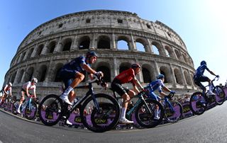 The peloton passes the Colosseum in Rome during stage 21 of the 2023 Giro d'Italia