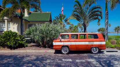 A vintage motor vehicle is parked on the brick paved streets of the historic Old Southeast Neighborhood in Saint Petersburg, Florida.