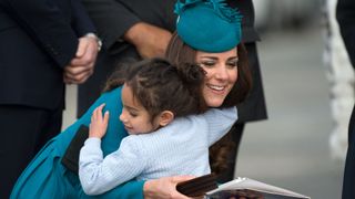 Kate Middleton hugging a young fan