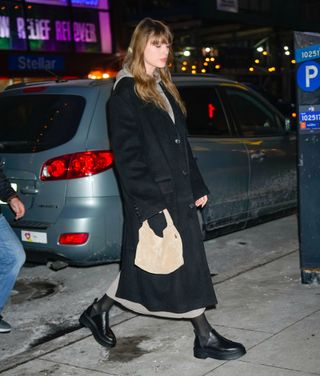 taylor swift in a cashmere dress and boots by the row