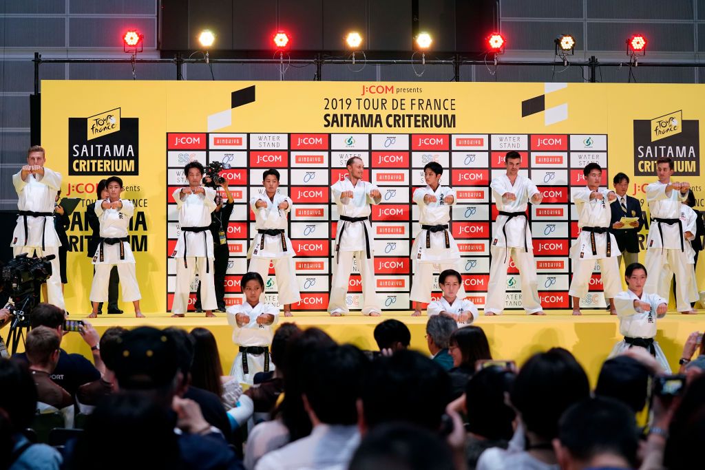 Riders do karate and football-darts before the 2019 Saitama Tour de France criterium