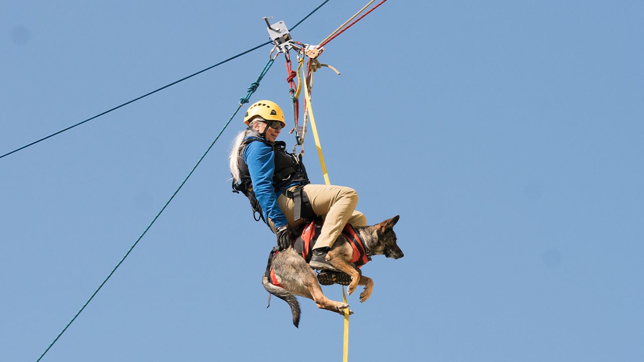 Sarah and Besa suspended on ropes