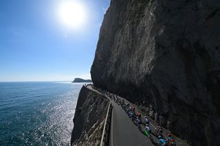 The riders race along the coast of the Mediterranean Sea towards Sanremo
