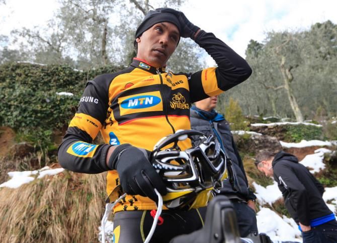 Plenty of warm clothes for the day's training ride as Ferekalsi Debesay Abrha makes some adjustments