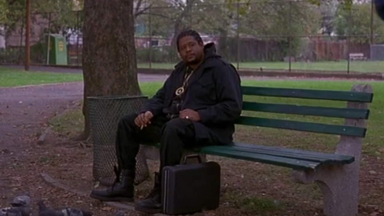 Forest Whitaker sitting on a park bench in Ghost Dog.